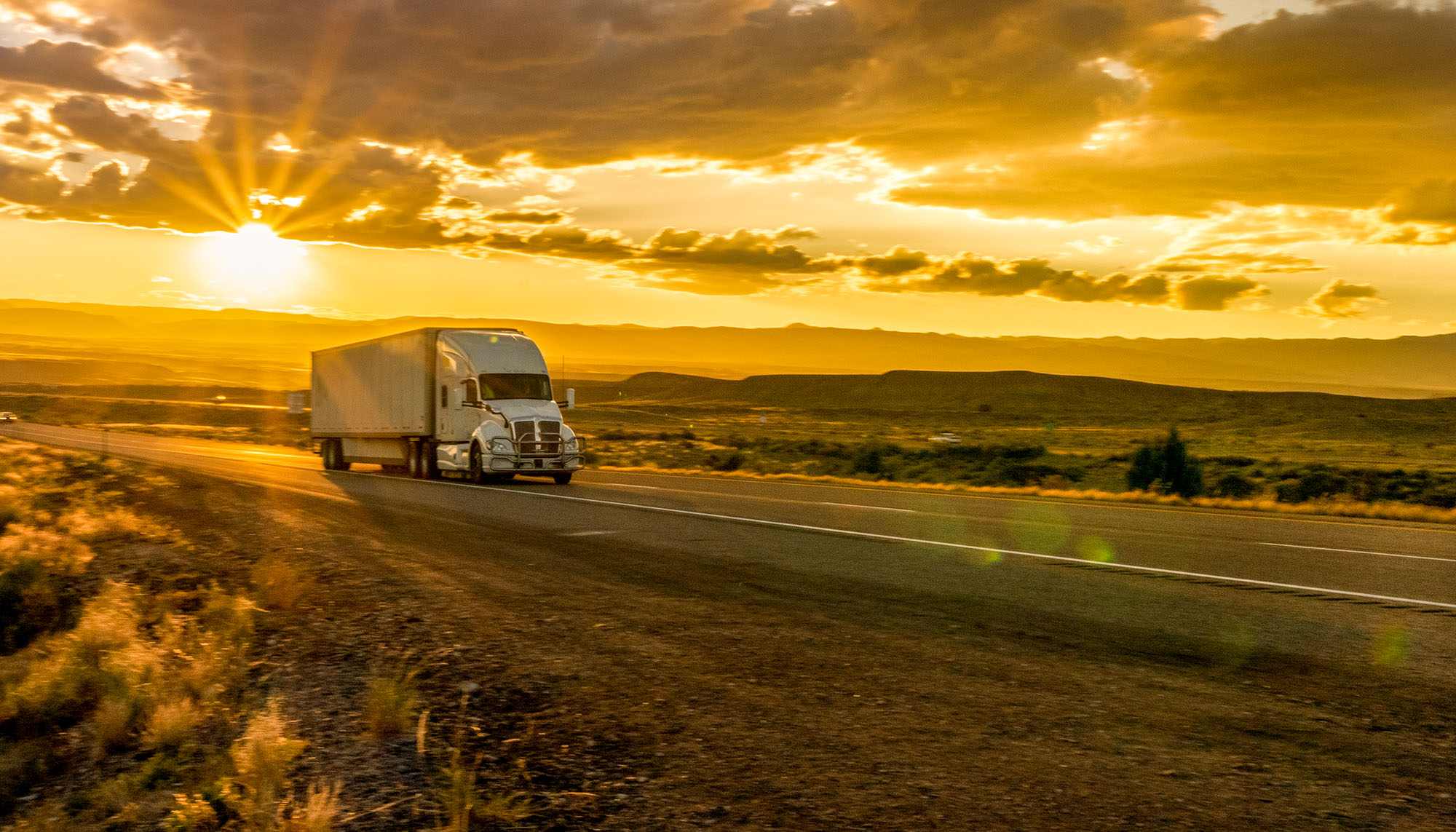 Semi-Truck on sun-soaked highway